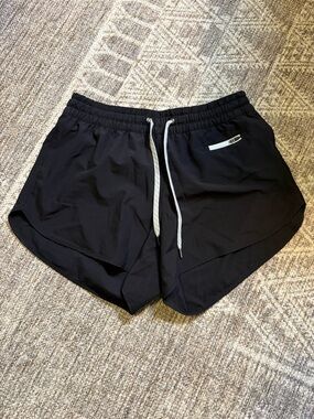 Vuori Black Performance Running Shorts with White Drawstring
